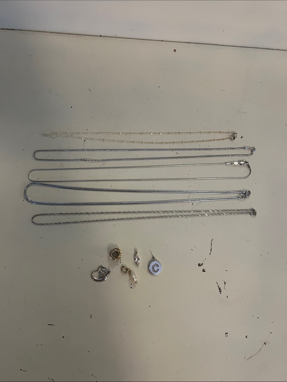 Silver Necklace and Charm Assortment